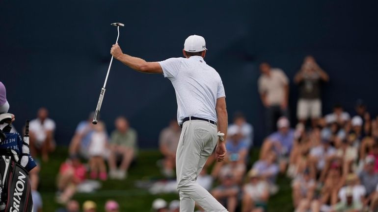 Keegan Bradley reacts after missing a putt on the 17th...