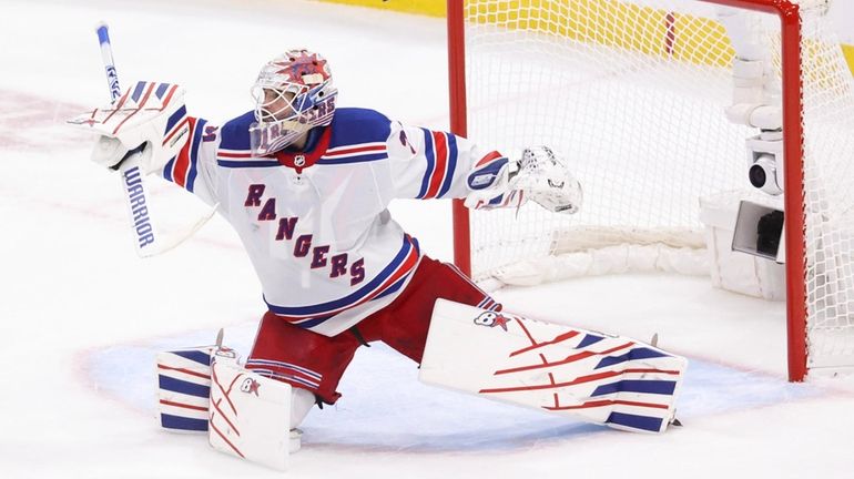 Igor Shesterkin of the Rangers defends his net during the...