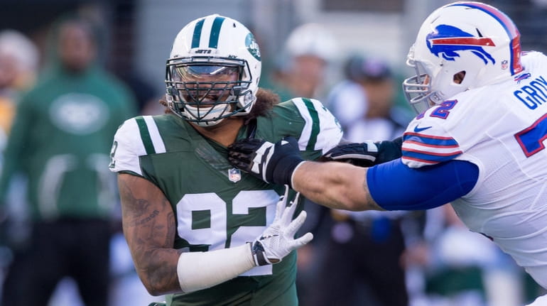 The Jets' Leonard Williams battles Bills center Ryan Groy on...