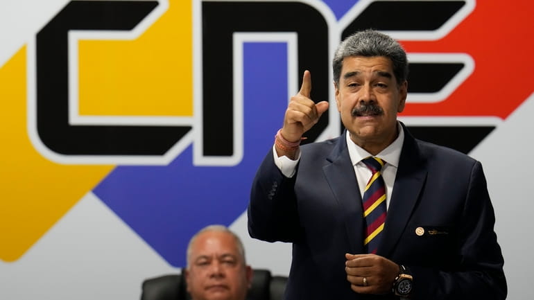 Venezuelan President Nicolas Maduro speaks after signing an agreement to...