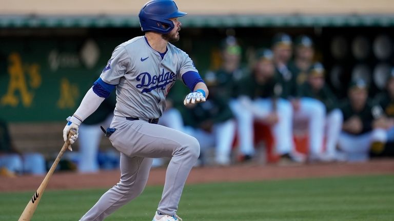 Los Angeles Dodgers' Gavin Lux watches his two-run single against...