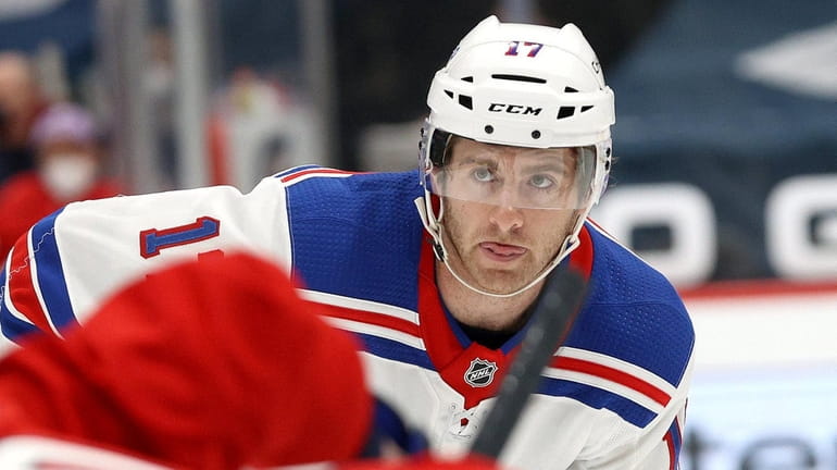 Kevin Rooney of the Rangers follows the puck against the Washington...