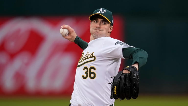 Oakland Athletics pitcher Ross Stripling throws to a Houston Astros...