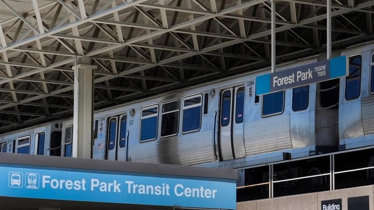 A Chicago Transit Authority Blue Line train waits at the...