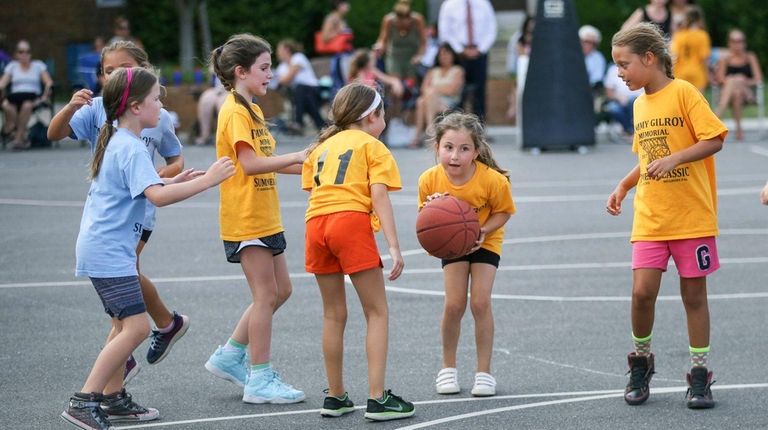 Young players participate in the Timmy Gilroy Summer Basketball League...