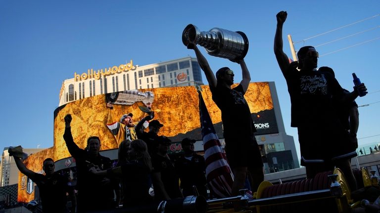 Vegas Golden Knights defenseman Nicolas Hague celebrates with the Stanley...