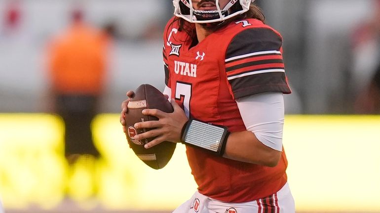 Utah quarterback Cameron Rising (7) looks downfield in the first...