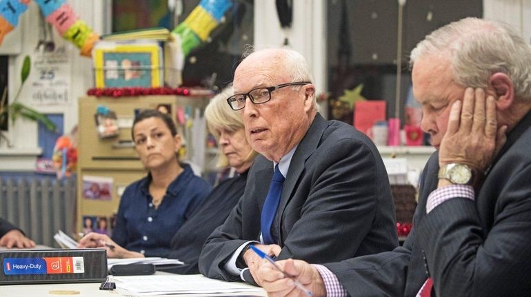 Tony Dill, center, president of the New Suffolk School, and...