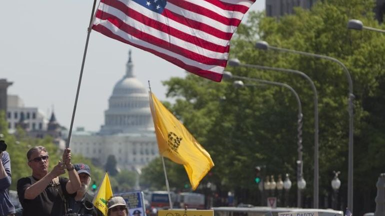 Tea party movement members demonstrate in Freedom Plaza in Washington...