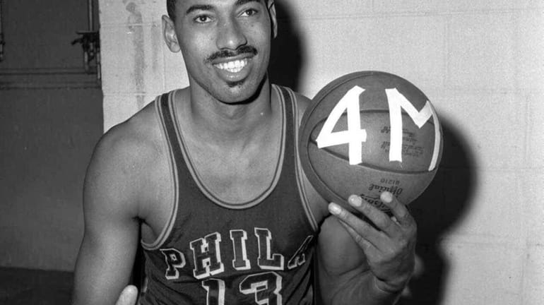 Wilt Chamberlain smiles after scoring his 4,031st point of the...