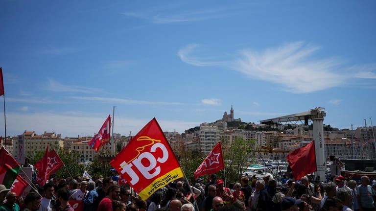 Protesters march during a demonstration in Marseille, southern France, Saturday,...