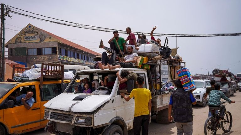 Palestinians fleeing from the southern Gaza city of Rafah during...