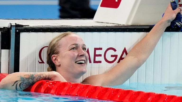 Sweden's Sarah Sjoestroem looks at the board after winning the...