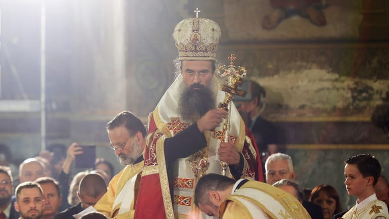 Newly elected Bulgarian Patriarch Daniil blesses the people during his...