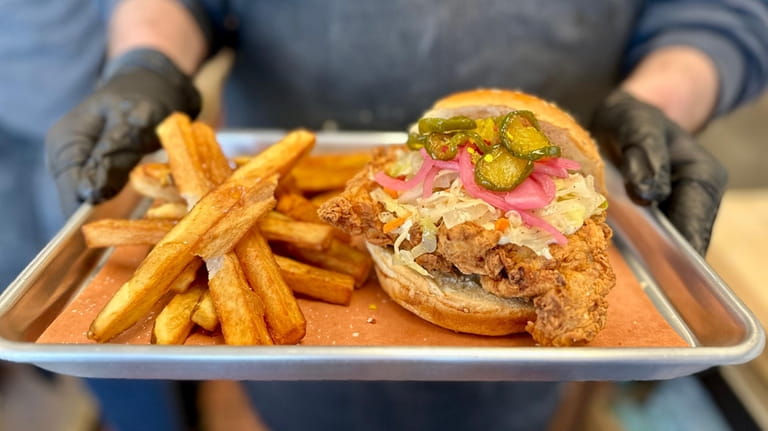 The fried chicken sandwich with candied jalapenos, pickled onion, vinegar...