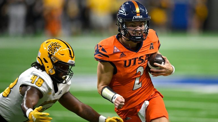 UTSA quarterback Owen McCown (2) attempts to evade Kennesaw State's...