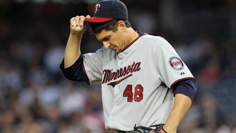 Carl Pavano #48 of the Minnesota Twins in action against...