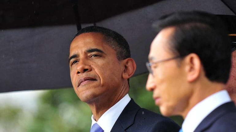 President Barack Obama, left, and South Korean President Lee Myung-bak...