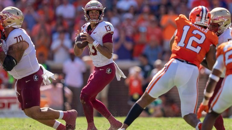 Florida State quarterback Jordan Travis looks to pass during the...