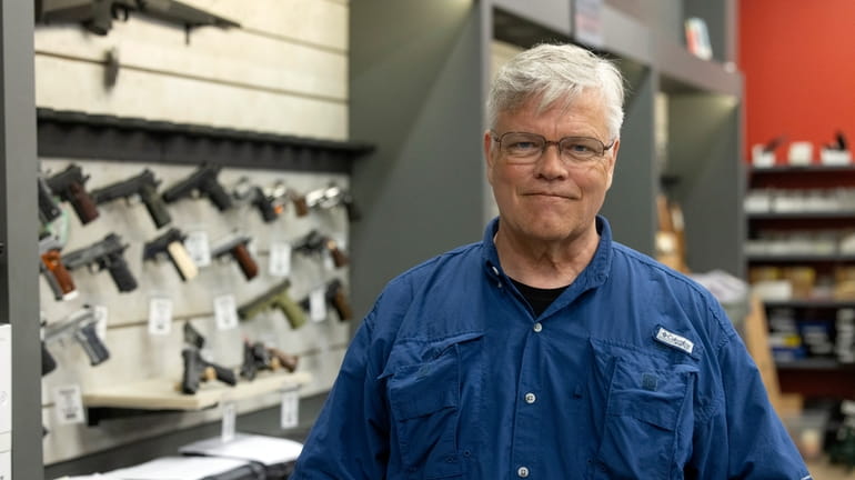 Maxon Shooter's Supplies owner Dan Eldridge poses in his store...
