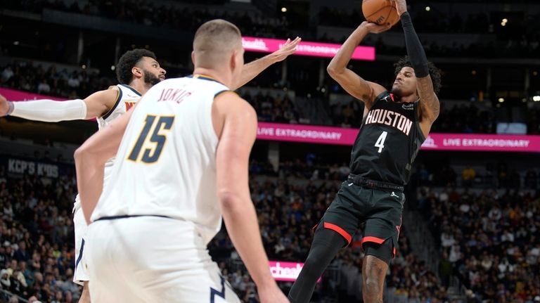 Houston Rockets guard Jalen Green shoots as Denver Nuggets guard...