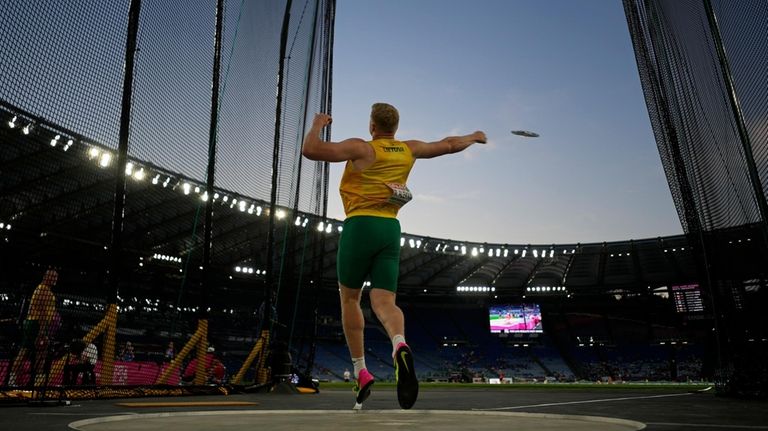 Mykolas Alekna, of Lithuania, makes an attempt in the men's...