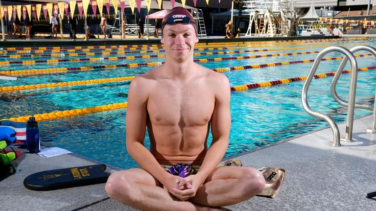 French Olympic swimmer Leon Marchand poses for a photograph prior...