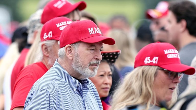 Supporters of former president Donald Trump wait outside of Middletown...