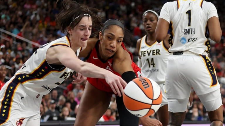 Indiana Fever guard Caitlin Clark, left, and Las Vegas Aces...