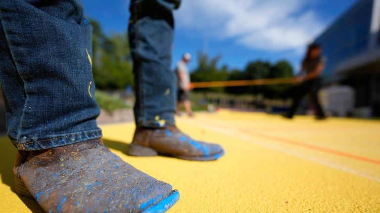 Ronnie Jefferies works on the parking lot at Science, Arts...