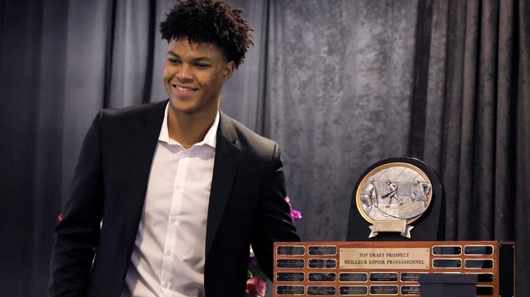 Medicine Hat Tigers' Cayden Lindstrom smiles after being awarded the...