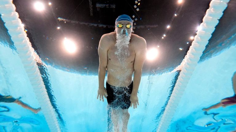 Leon Marchand, of France, competes in the men's 200-meter breaststroke...