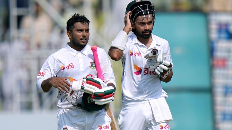 Bangladesh's Shadman Islam, right, and Zakir Hasan walks off the...