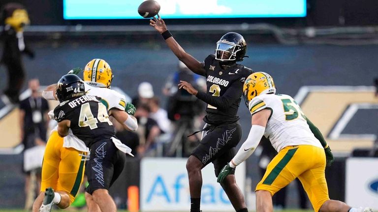 Colorado quarterback Shedeur Sanders passes during the first half of...