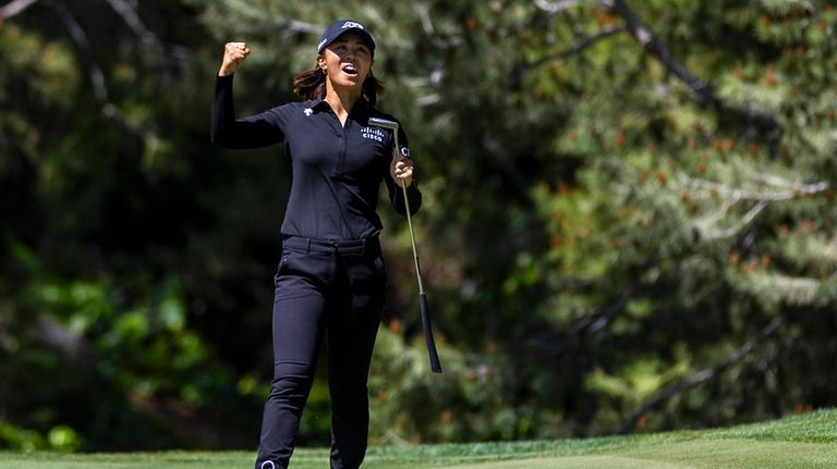 Danielle Kang reacts to a putt on the ninth hole...