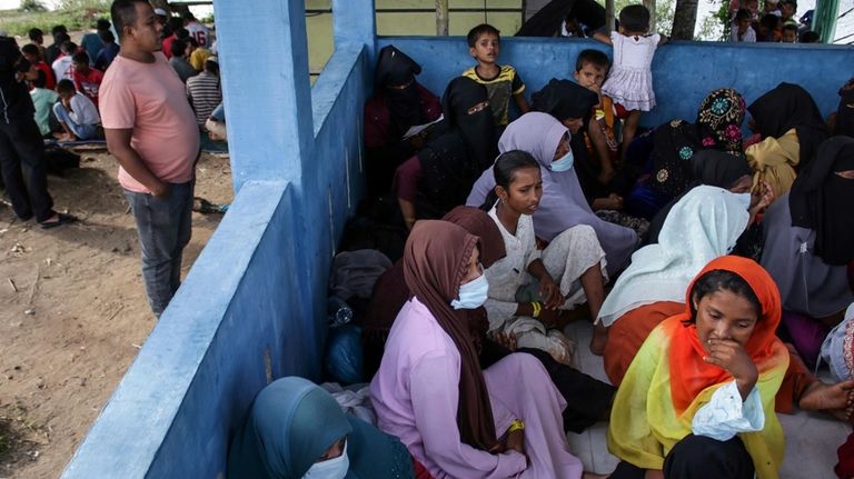 Newly-arrived ethnic Rohingya women, part of a group who was...