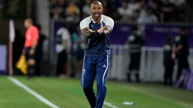 France's head coach Thierry Henry reacts during a quarter final...