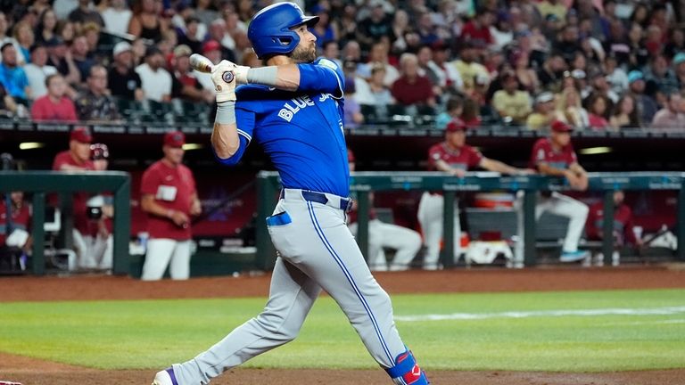 Toronto Blue Jays' Kevin Kiermaier watches the flight of his...