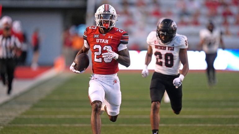 Utah running back Dijon Stanley (23) outruns Southern Utah safety...