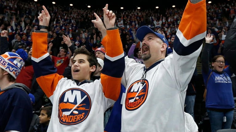 Fans cheer after the Islanders scored a second period goal...