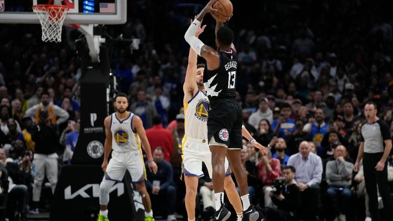 LA Clippers forward Paul George (13) shoots a 3-pointer against...