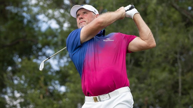 Co-Captain Lee Westwood of Majesticks GC hits his shot from...