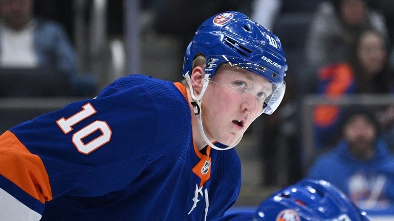 Islanders right wing Simon Holmstrom sets before a face off...