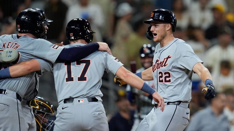 Detroit Tigers' Parker Meadows, right, celebrates with teammates Jace Jung,...