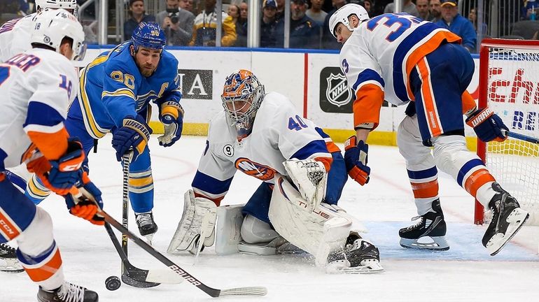 St. Louis Blues' Brandon Saad (20) reaches for a loose...