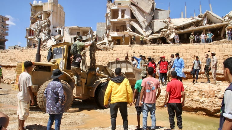 People look for survivors in Derna, Libya, Wednesday, Sept.13, 2023....