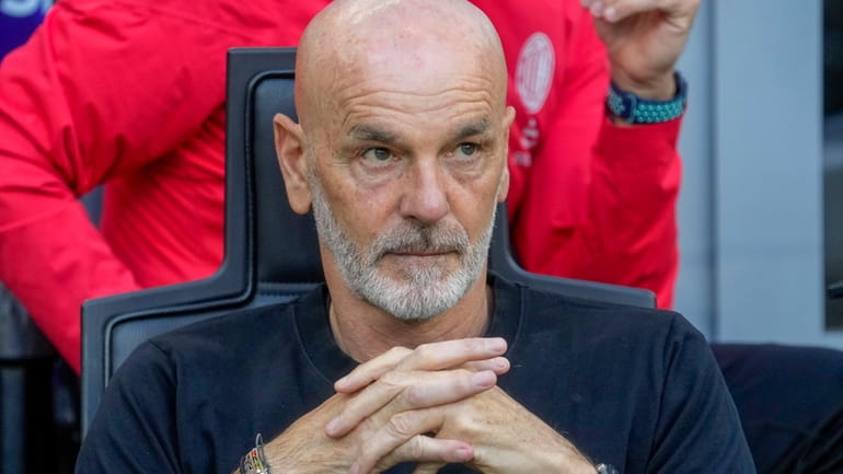 AC Milan's manager Stefano Pioli looks out from the bench...