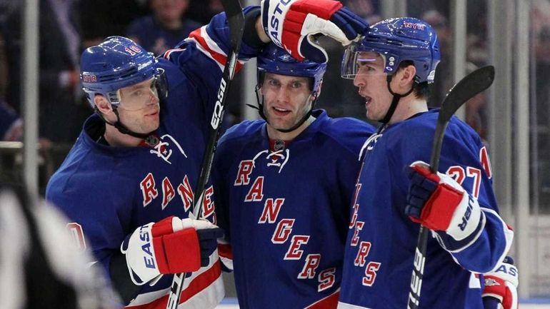 Dan Girardi #5 of the New York Rangers celebrates his...