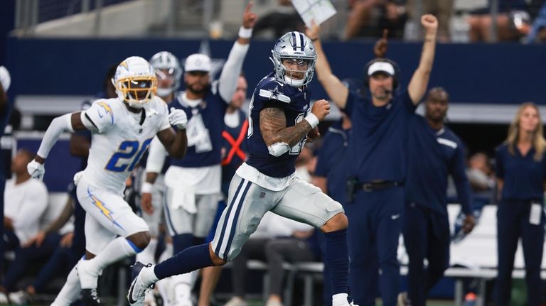 Dallas Cowboys quarterback Trey Lance runs for a touchdown during...