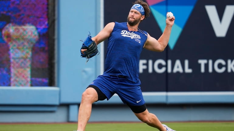 Los Angeles Dodgers' Clayton Kershaw works out before a baseball...
